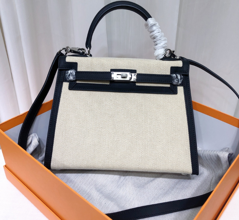 Top Selling Kelly 25 Bag With Outside Stitching, Made Of Textured Canvas & Soft Swift Leather Patchwork, Classic Black Silver Hardware Combination, Stunning Mixed Material Texture Dimensions: Length 25 * Width 10 * Height 18cm
