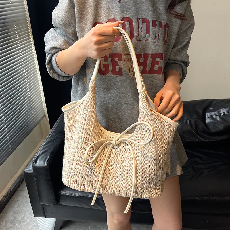 Multi-Tone Woven Shoulder Tote with Front Knotted Ribbon Embellishment and Curved Cutout Upper Profile Handbag