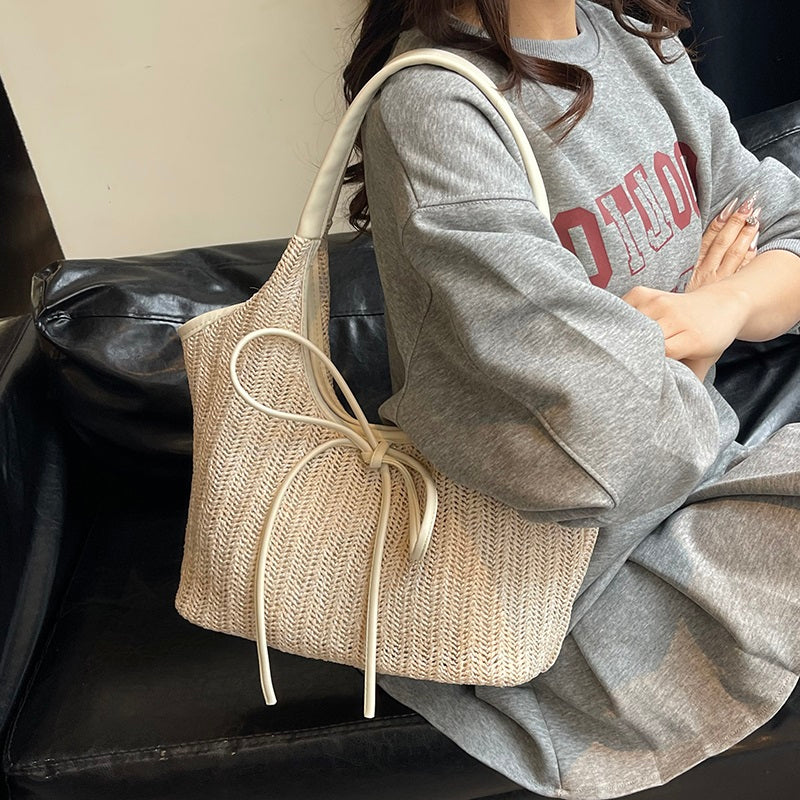 Multi-Tone Woven Shoulder Tote with Front Knotted Ribbon Embellishment and Curved Cutout Upper Profile Handbag