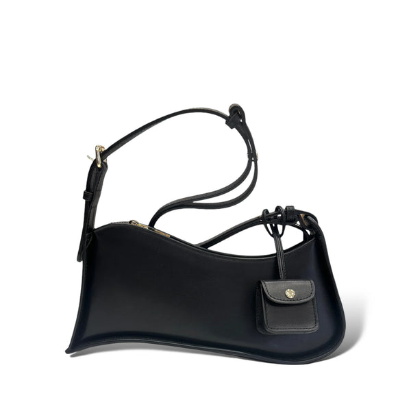 Multi-Tone Asymmetrical Curved Slim Shoulder Carry Vessel Diminutive Snap Pouch Dangling Accent and Sleek Sealed Top Track Handbag