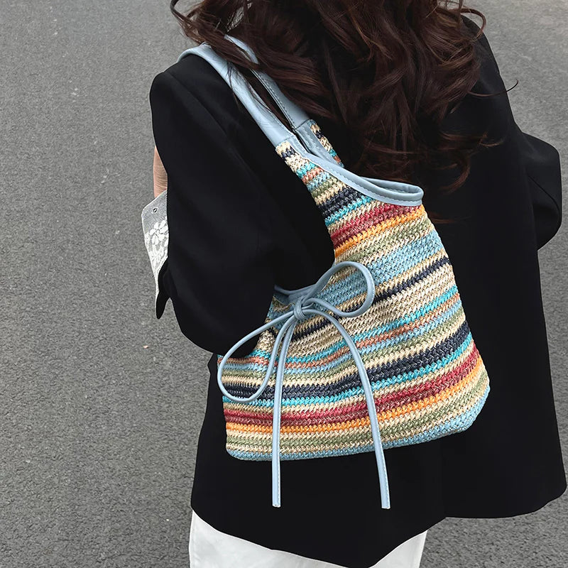 Multi-Tone Woven Shoulder Tote with Front Knotted Ribbon Embellishment and Curved Cutout Upper Profile Handbag
