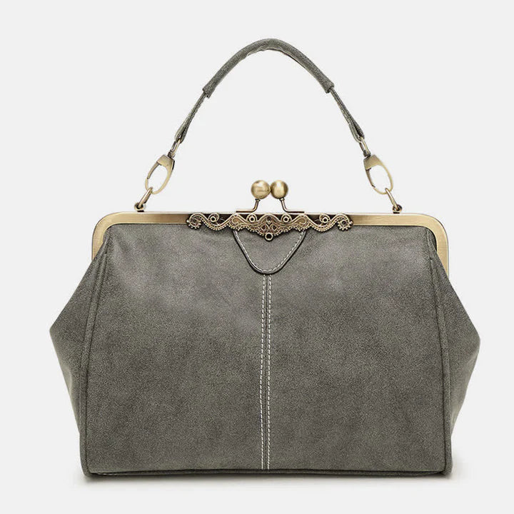 Multi-Tone Flared Gusset Vintage Framed Carry Vessel with Ornamental Metallic Kiss Lock Partitioned Inner Storage